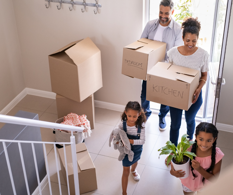 Family moving into their new Central Ohio home with labeled boxes